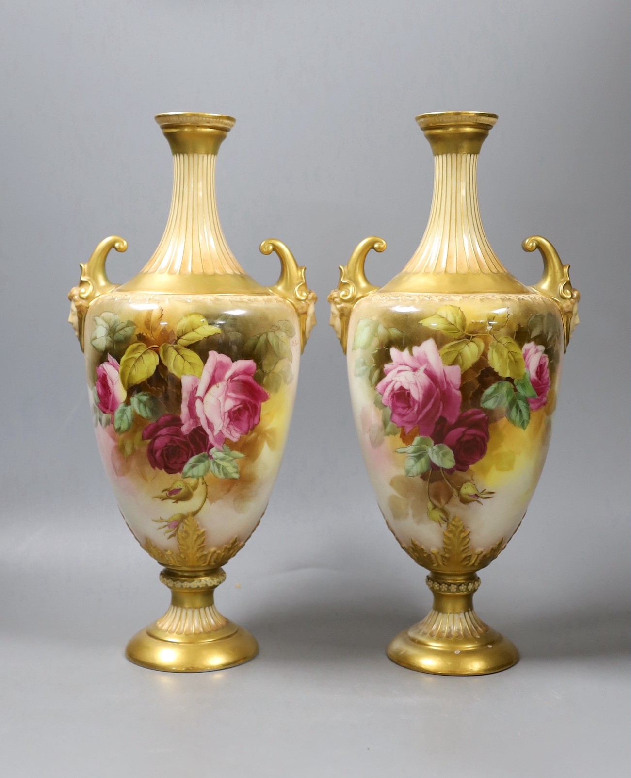 A pair of Royal Worcester rose painted vases, signed W. Hart - 34cm tall